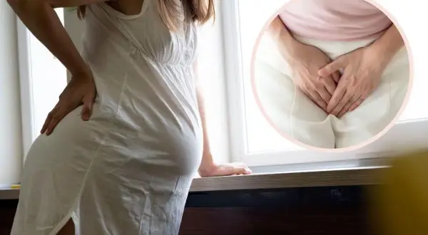 Kobieta w ciąży odczuwa dyskomfort. W okręgu widać dłonie zakrywające okolice intymne, sugerujące żylaki sromu w ciąży.